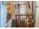 Unique staircase featuring a hand-painted tree mural, wood railing, and decorative touches at 854 77Th N Ave, St Petersburg, FL 33702