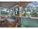 Cozy sunroom with built-in seating, wood accents, and bright, airy ambiance at 854 77Th N Ave, St Petersburg, FL 33702