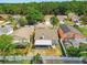 Aerial view of the backyard with screened-in patio and fencing at 8736 Huntfield St, Tampa, FL 33635