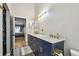 Bathroom boasts double sinks, marble countertops, and modern fixtures in a sleek design at 8736 Huntfield St, Tampa, FL 33635