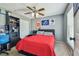 Bedroom shows decor shelves, a ceiling fan and a double bed at 8736 Huntfield St, Tampa, FL 33635