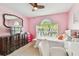 Bright bedroom with a large window, dresser, and desk area at 8736 Huntfield St, Tampa, FL 33635