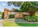 The community sign for Glen Oaks surrounded by lush greenery at 8736 Huntfield St, Tampa, FL 33635