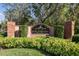 A stone sign for the Countryway community surrounded by lush landscaping at 8736 Huntfield St, Tampa, FL 33635