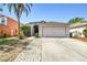 Charming single-Gathering home featuring a two-car garage and well-manicured lawn, perfect for Gathering living at 8736 Huntfield St, Tampa, FL 33635