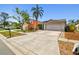Well-maintained single-Gathering home with a spacious driveway, showcasing curb appeal and a welcoming atmosphere at 8736 Huntfield St, Tampa, FL 33635