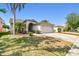 Inviting single-Gathering home with lush landscaping and a spacious driveway, bathed in sunlight at 8736 Huntfield St, Tampa, FL 33635