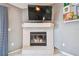 Cozy living room fireplace with a white brick surround and mantel, perfect for relaxing evenings at 8736 Huntfield St, Tampa, FL 33635