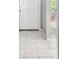 Bright foyer features elegant tiled flooring, leading to inviting living spaces with abundant natural light at 8736 Huntfield St, Tampa, FL 33635