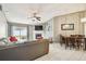 Cozy living room features a fireplace, tile floors, and sliding glass doors to the outdoor space at 8736 Huntfield St, Tampa, FL 33635
