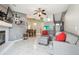 Open concept living room and dining area featuring tiled floors and comfortable seating at 8736 Huntfield St, Tampa, FL 33635