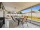 The screened patio is great for outdoor dining and entertainment with a view of the yard at 8736 Huntfield St, Tampa, FL 33635