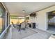 Screened patio featuring tile flooring, ceiling fan, and space for outdoor relaxation and entertaining at 8736 Huntfield St, Tampa, FL 33635