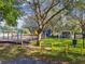 Community playground with slides, swings, picnic tables, and shaded seating at 8736 Huntfield St, Tampa, FL 33635