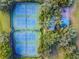 Aerial view of four community tennis courts and a covered playground area at 8736 Huntfield St, Tampa, FL 33635