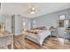 Bedroom features wood floors, ceiling fan, and a view of the bathroom at 8740 15Th N St, St Petersburg, FL 33702
