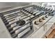 Close up of a stainless steel cooktop with five burners at 8740 15Th N St, St Petersburg, FL 33702