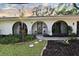 Charming home with manicured lawn and unique architectural details at 8740 15Th N St, St Petersburg, FL 33702