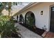 Beautiful house with landscaped front yard and unique arched entryway at 8740 15Th N St, St Petersburg, FL 33702