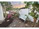 Serene garden nook featuring a bench and vibrant flowering plants at 8740 15Th N St, St Petersburg, FL 33702