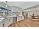 Bright kitchen features stainless steel appliances, white cabinets, and is open to the dining area at 8740 15Th N St, St Petersburg, FL 33702