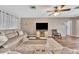 Cozy living room with plush seating and a ceiling fan at 8740 15Th N St, St Petersburg, FL 33702