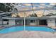 Inviting screened-in pool with patio and a glimpse of the backyard at 8740 15Th N St, St Petersburg, FL 33702