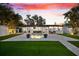 Outdoor living with private backyard, beautiful pool and lush green lawn at 8848 Sunlit Cove Ne Dr, St Petersburg, FL 33702