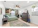 This quirky bedroom features vinyl record art, light wood floors and neutral paint at 8848 Sunlit Cove Ne Dr, St Petersburg, FL 33702