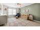 Inviting Bedroom with accent wall, crib, and comfortable sitting area at 8848 Sunlit Cove Ne Dr, St Petersburg, FL 33702