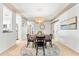 Inviting dining area featuring round table, pendant lighting, and an open layout at 8848 Sunlit Cove Ne Dr, St Petersburg, FL 33702