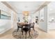 Inviting dining room with a round table, pendant lighting, and neutral color palette for gatherings at 8848 Sunlit Cove Ne Dr, St Petersburg, FL 33702
