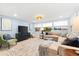 Bright and airy living room with large windows and a view of the water at 8848 Sunlit Cove Ne Dr, St Petersburg, FL 33702