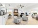 Bright living room with a fireplace and views into another room at 8848 Sunlit Cove Ne Dr, St Petersburg, FL 33702