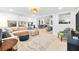 Living room showcases an open floor plan, neutral color palette, modern decor and an area rug at 8848 Sunlit Cove Ne Dr, St Petersburg, FL 33702