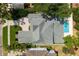 Overhead view of a home highlighting the backyard pool, patio and well-kept lawn at 911 S Sterling Ave, Tampa, FL 33629
