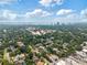 Wide aerial shot of a community with the ocean and city skyline in the background at 911 S Sterling Ave, Tampa, FL 33629