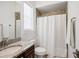 Bathroom featuring a granite countertop, and shower with a white shower curtain at 911 S Sterling Ave, Tampa, FL 33629