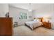 Bedroom featuring neutral carpet, wood furniture and modern lighting at 911 S Sterling Ave, Tampa, FL 33629