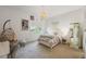 Light and airy bedroom with modern decor and a cozy egg chair at 911 S Sterling Ave, Tampa, FL 33629