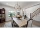 Dining room features a large wooden table, and a grand clock at 911 S Sterling Ave, Tampa, FL 33629