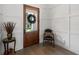 Stylish entryway showcasing a wood door, elegant decor, and hardwood floors at 911 S Sterling Ave, Tampa, FL 33629