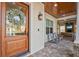 Welcoming front porch featuring comfortable seating, a wood-paneled ceiling, and a view of the outdoors at 911 S Sterling Ave, Tampa, FL 33629