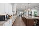 Gourmet kitchen featuring a large island, stainless steel appliances, and plenty of counter space for cooking at 911 S Sterling Ave, Tampa, FL 33629