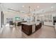 Spacious kitchen with island and breakfast bar, flowing into a living area, and ample natural light at 911 S Sterling Ave, Tampa, FL 33629