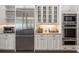 Modern kitchen featuring stainless steel appliances, granite countertops and ample storage space at 911 S Sterling Ave, Tampa, FL 33629
