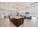 Open-concept kitchen with a large island, pendant lighting, and views into the Gathering room at 911 S Sterling Ave, Tampa, FL 33629