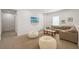 Spacious living room featuring a sectional couch, bean bag chairs, a large TV, and recessed lights at 911 S Sterling Ave, Tampa, FL 33629