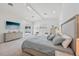 Spacious main bedroom features neutral colors, sitting area, and sliding glass door to private patio at 911 S Sterling Ave, Tampa, FL 33629