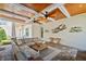 Comfortable outdoor living space with ceiling fans, a cozy sectional, and stylish decor at 911 S Sterling Ave, Tampa, FL 33629